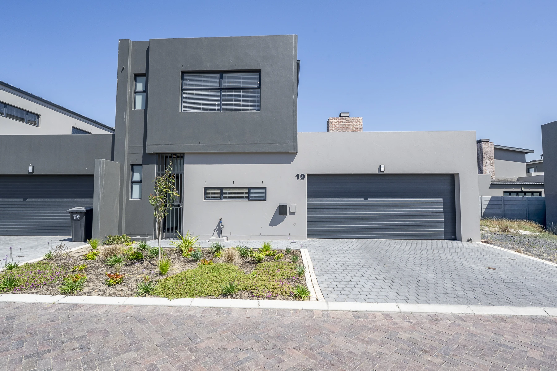 Greystone exterior with garden